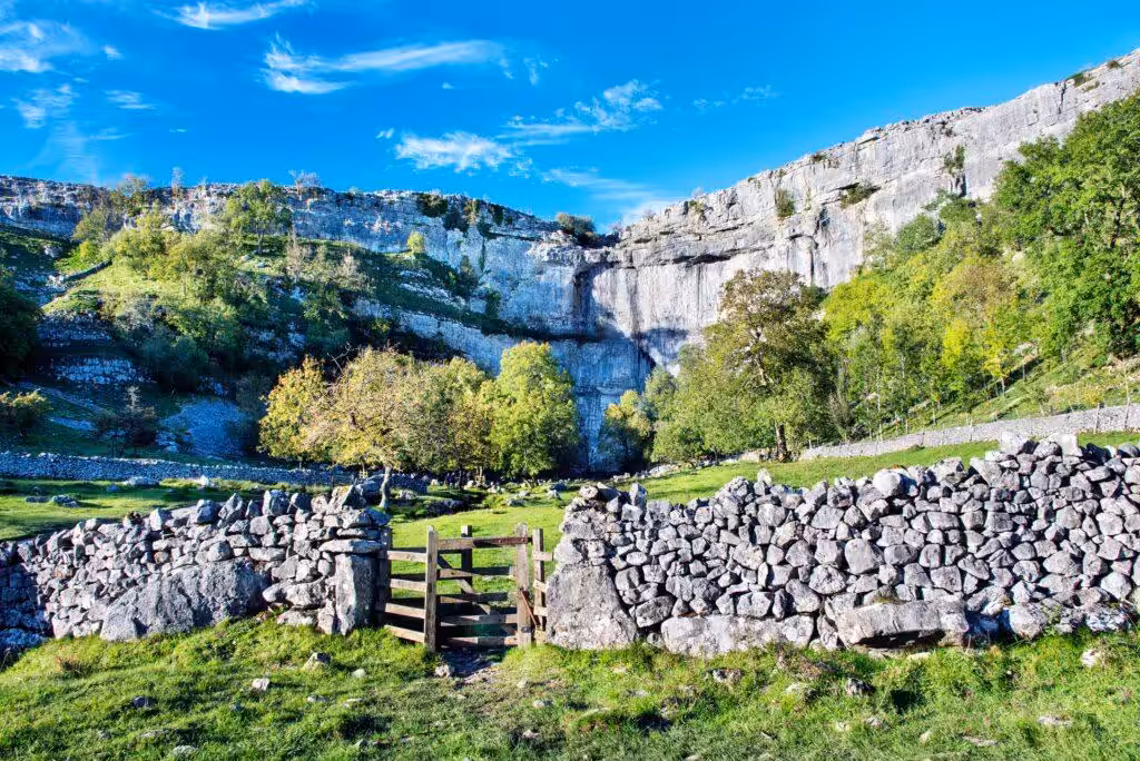 Malham Cove, a large vertical ampitheatre shaped cliff face formation in the Pennines
